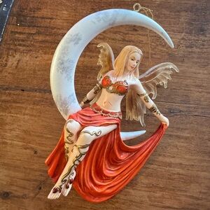 “Fire Moon”
Fairy figurine by Nene Thomas.